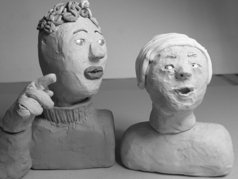 two head and shoulder plasticine puppets