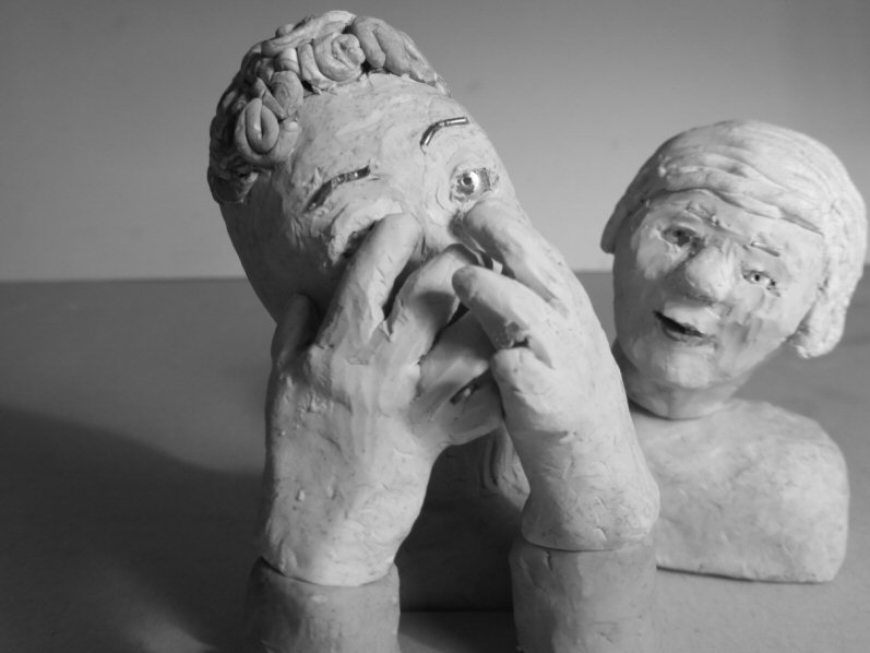 tabletop view of two puppet heads