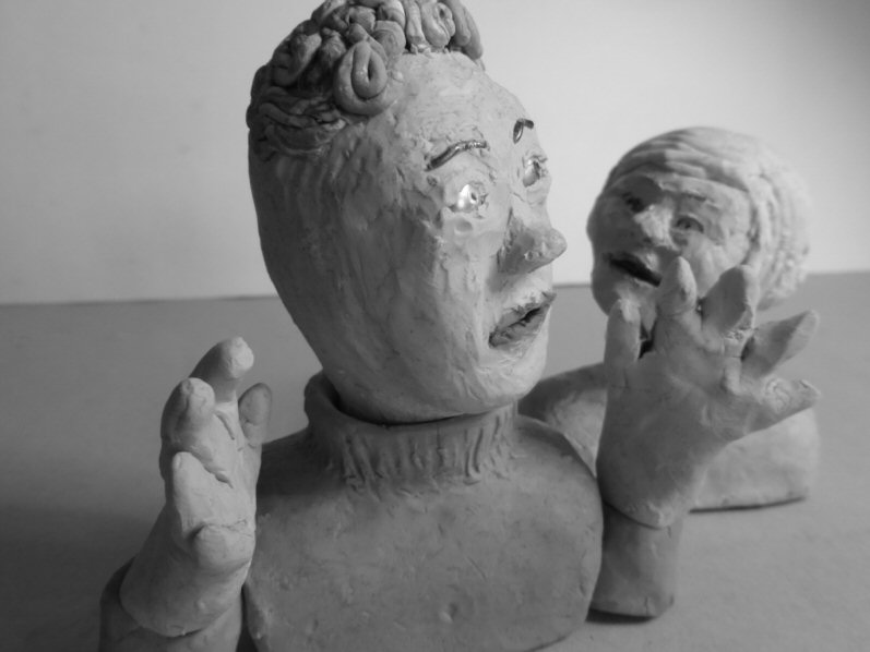 closeup of two puppet heads