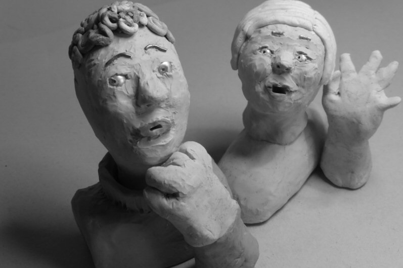 two plasticine heads looking anxious