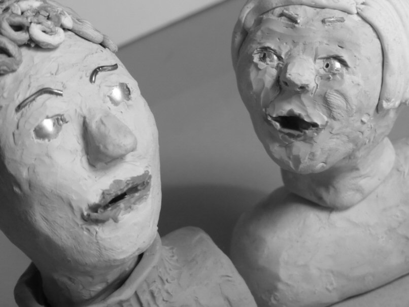 two plasticine heads