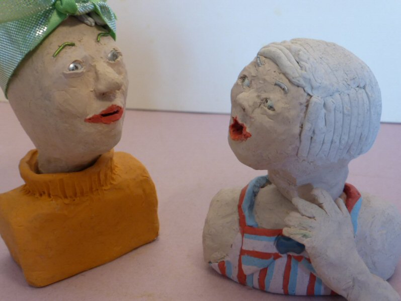 2 plasticine heads in conversation