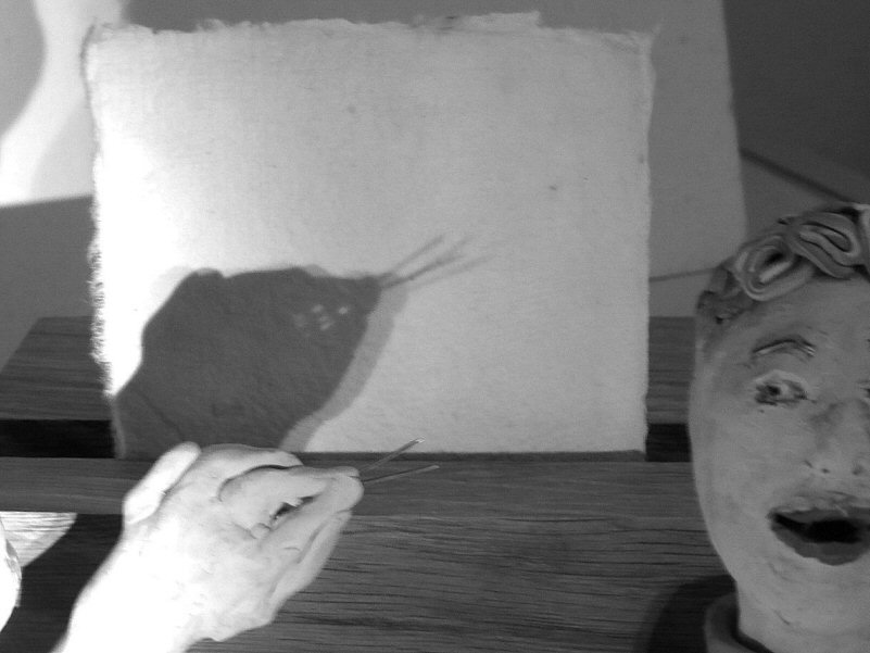 plasticine heads and shadow puppet of snake